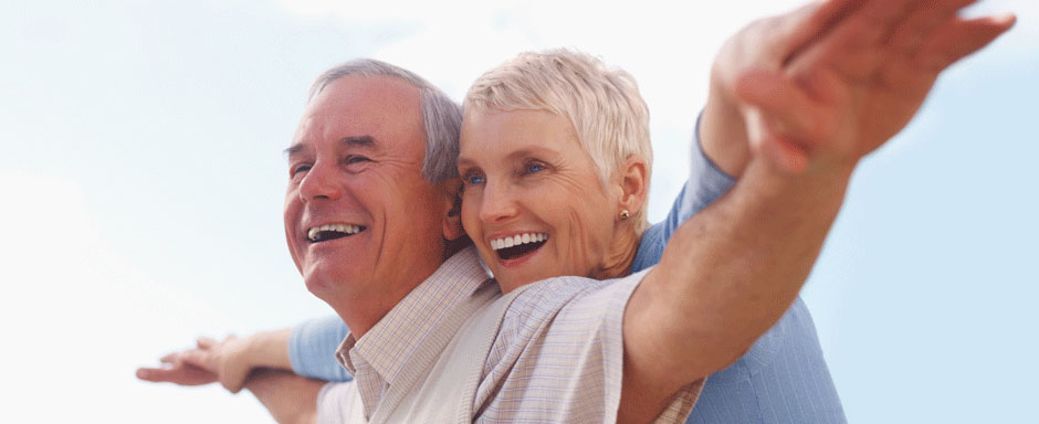 An older couple enjoying a happy moment outdoors